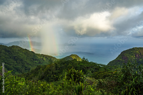 rainbow and rain over the jungle and mountains of mahé, seychelles 16