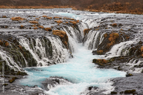 Bruarfoss (Bridge Fall), is a waterfall on the river Bruara, in southern Iceland where a series of small runlets of water runs into a beautiful, turquoise-blue colored pool.