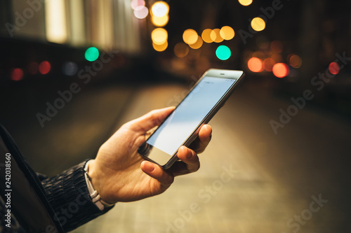 Close-up woman's hand holding mobile phone