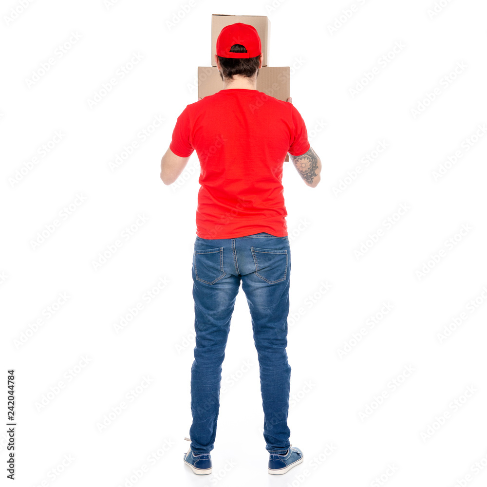 Delivery man in red uniform holding box package back view isolated on white background Delivery man in red uniform holding box package back view isolated on white background