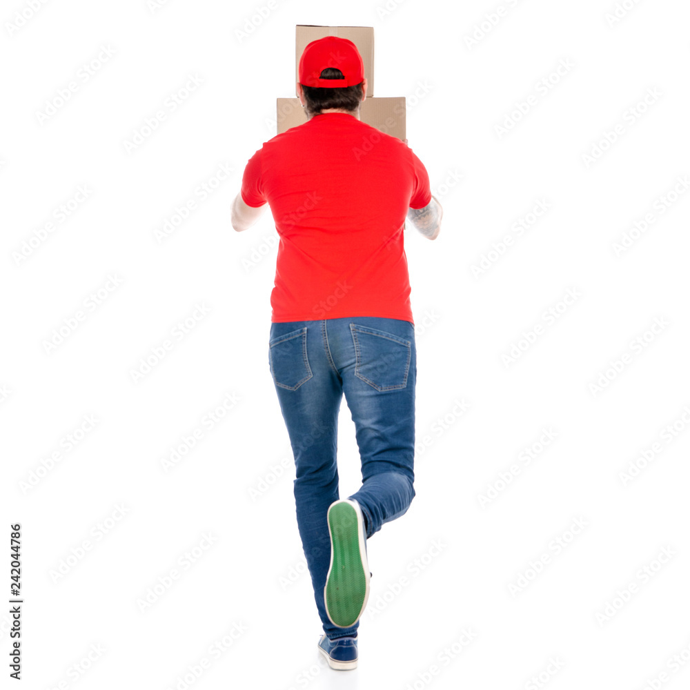 Delivery man in red uniform holding box package back view isolated on white background Delivery man in red uniform holding box package back view isolated on white background