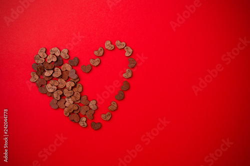 Form heart made of many wooden hearts
