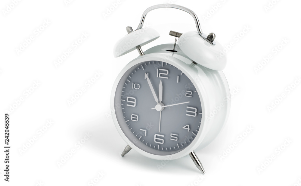 Twin bells analogue alarm clock shows time 5 to 12 with gray clock face, 11.55 AM PM, on white background Twin bells analogue alarm clock shows time 5 to 12 with gray clock face, 11.55 AM PM, on white background