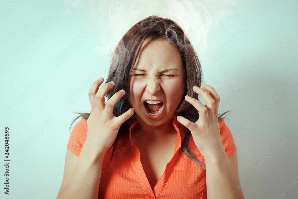 a young girl depicts a strong nervous tension and stress with the help of  her face and hands. Stock Photo | Adobe Stock