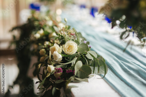 Flowesr on the wedding table in restaurant photo