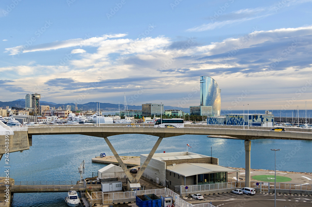 Port Vell with its cruise terminal, bridge Porta d'Europa and W Barcelona early in the morning