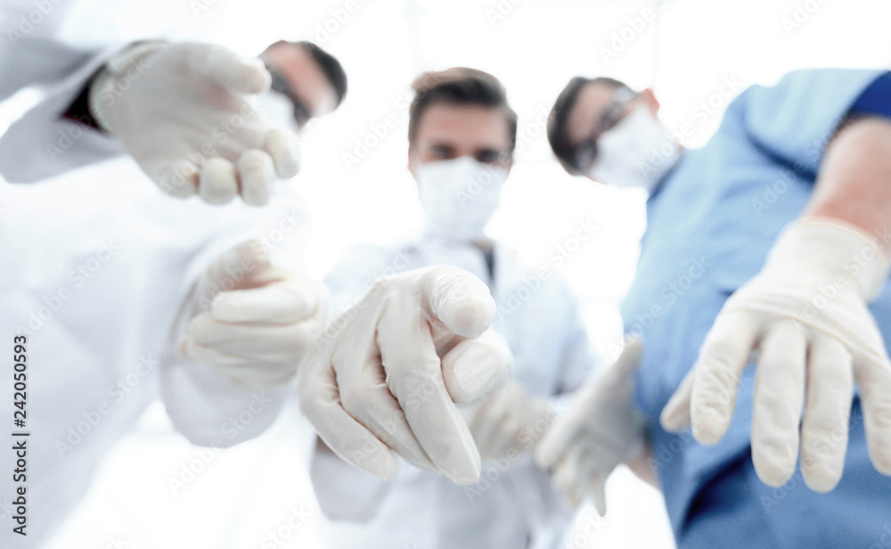 bottom view.a group of doctors in the operating room. bottom view.a group of doctors in the operating room.