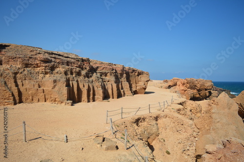 rocks and caves in front of the sea