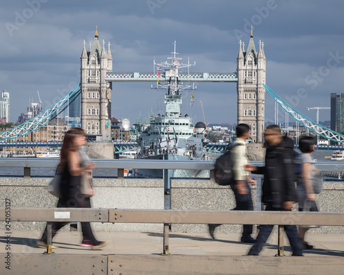 Crossing the Thames on the footbridge with tower bridge in the background photo