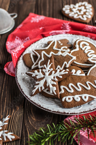 Christmas homemade gingerbread cookies on wooden background. New year and christmas postcard