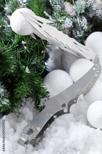 winter composition hookah tongs of a Christmas tree and snow with garlands on the background photo