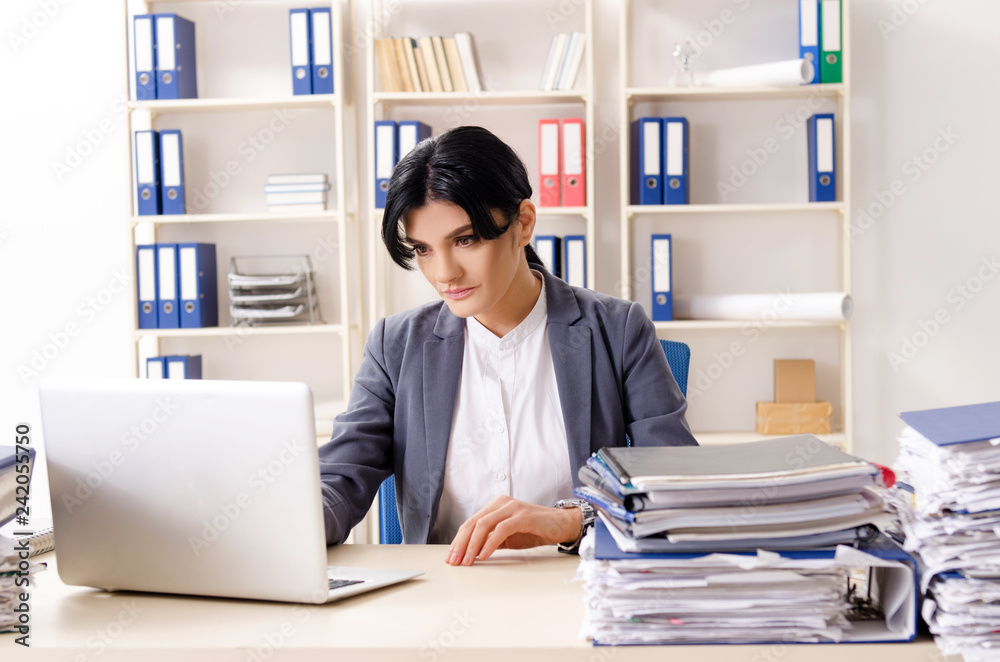 Middle aged businesslady unhappy with excessive work 