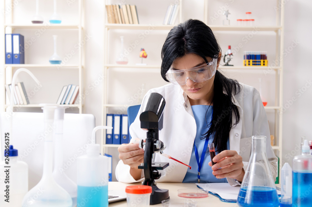 Female chemist working at the lab Female chemist working at the lab