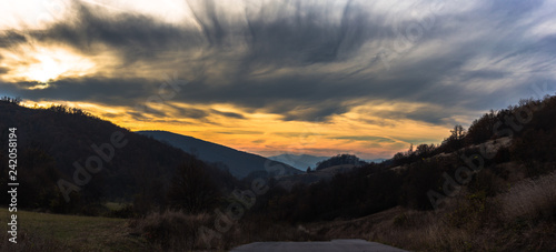 Panoramic view of dramatic sky with clouds at sunset