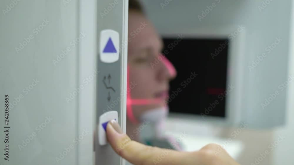 Man patient in X-ray machine scanner in medical cabinet in hospital. Work place of doctor in clinic. Healthcare Man patient in X-ray machine scanner in medical cabinet in hospital. Work place of doctor in clinic. Healthcare