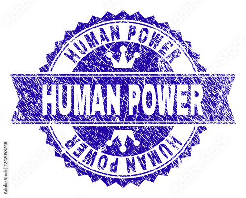 HUMAN POWER rosette stamp imitation with distress texture. Designed with round rosette, ribbon and small crowns. Blue vector rubber watermark of HUMAN POWER text with scratched texture.