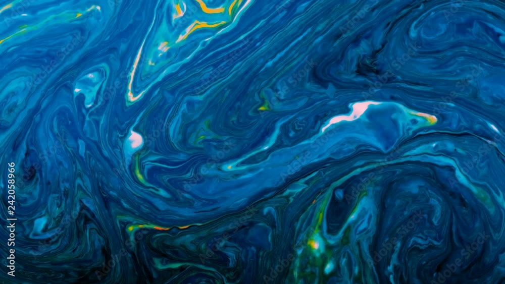 Neon psychedelic paints are mixed in a black liquid, abstract patterns spread Neon psychedelic paints are mixed in a black liquid, abstract patterns spread