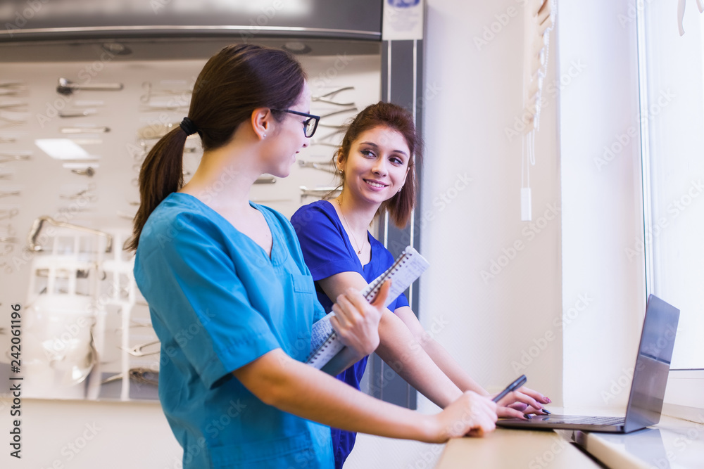 two girls nurses are studying surgical instruments. Medical education two girls nurses are studying surgical instruments. Medical education