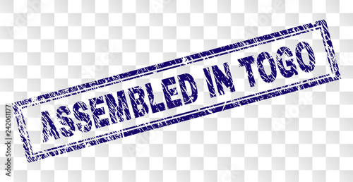 ASSEMBLED IN TOGO stamp seal print with dirty style and double framed rectangle shape. Stamp is placed on a transparent background.