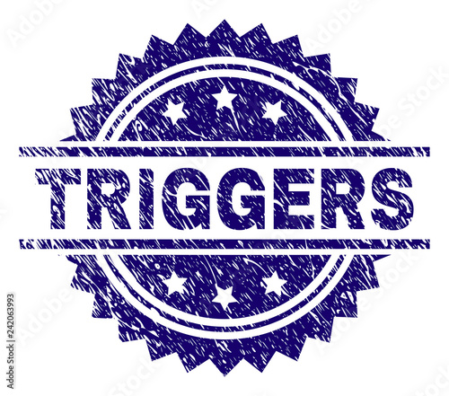 TRIGGERS stamp seal watermark with distress style. Blue vector rubber print of TRIGGERS text with unclean texture.