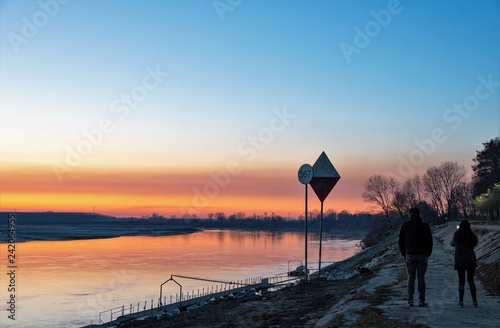 Two people by the river photo