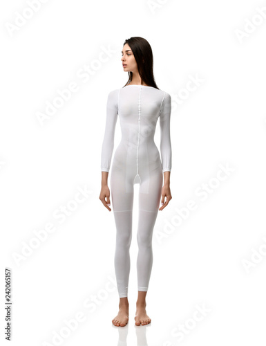 Full body brunette woman in white single use suit cloth ready for medical science research experiment full length 