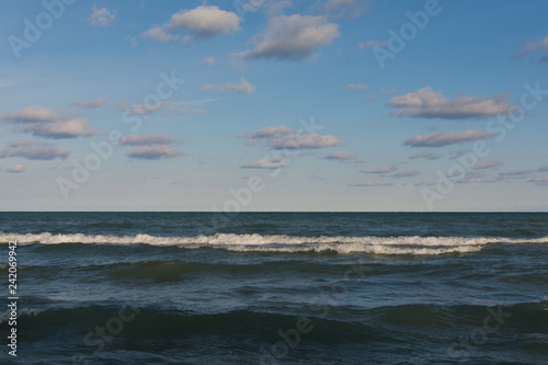 Lake Michigan on a beautiful Autumn morning with blue skies and clouds above.  Indiana Dunes  Indiana  USA