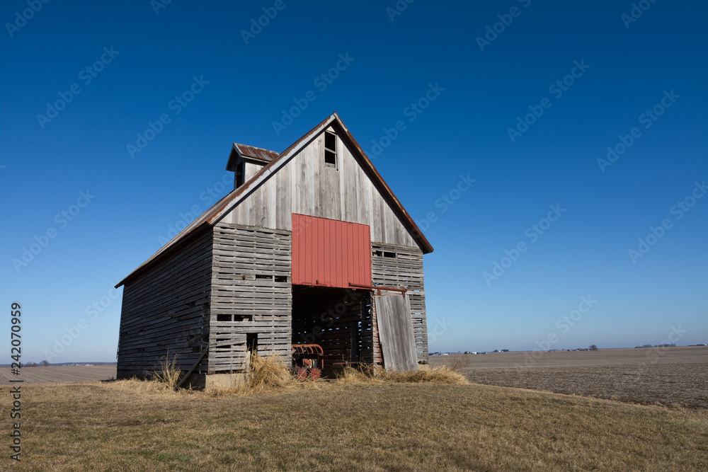 Old wooden barn in the rural open farmland. Illinois, USA Old wooden barn in the rural open farmland. Illinois, USA