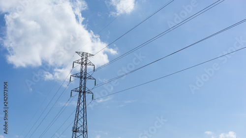 electricity pylon on blue sky and clouds