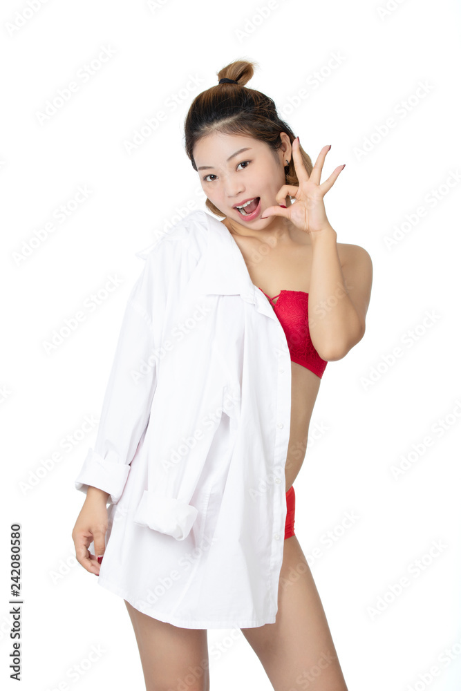 Chinese woman posing in white shirt on white background Chinese woman posing in white shirt on white background