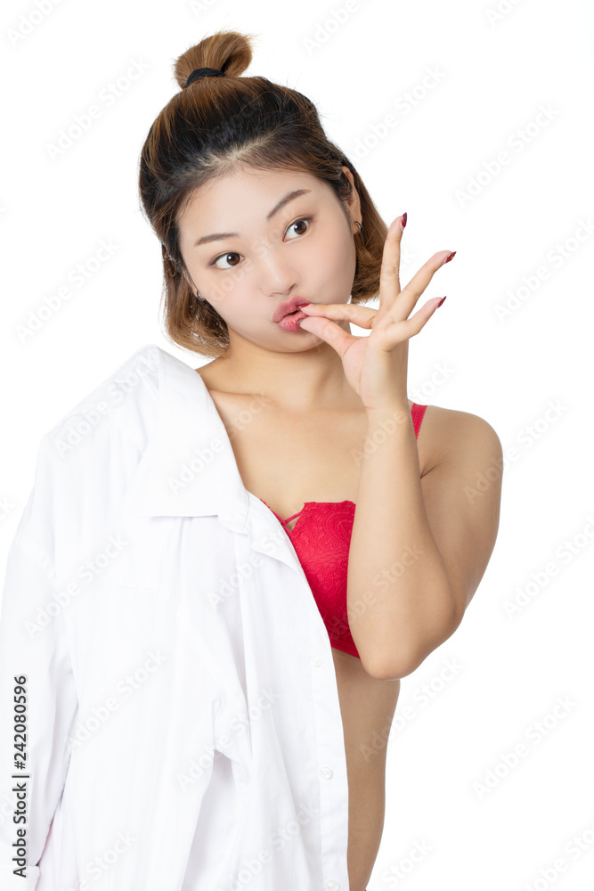 Chinese woman posing in white shirt on white background Chinese woman posing in white shirt on white background