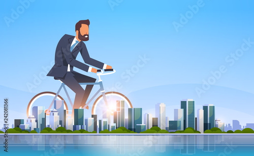 businessman riding bicycle office worker cycling healthy lifestyle concept business man over big modern city building skyscraper cityscape skyline flat horizontal