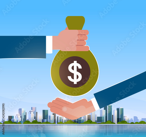 business hand giving money to businessman salary credit loan payment over big modern city building skyscraper cityscape skyline flat horizontal