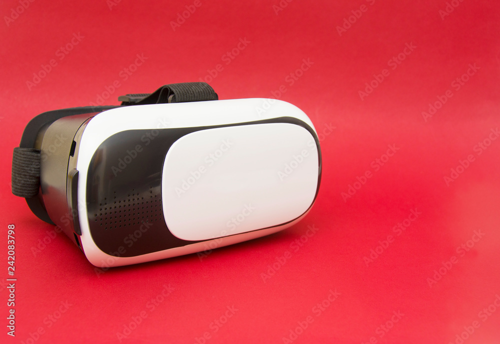 Virtual reality helmet isolated on red background Virtual reality helmet isolated on red background