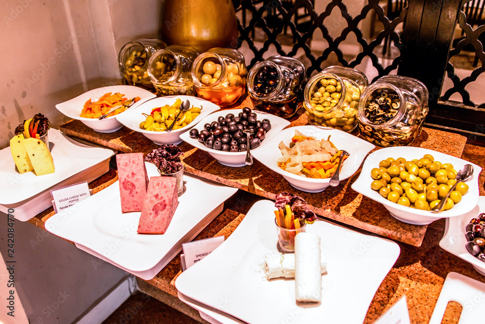 Variety food buffet table, wine snack set, olives, cheese and other  appetizer, italian antipasti on plate in Egypt Stock Photo | Adobe Stock