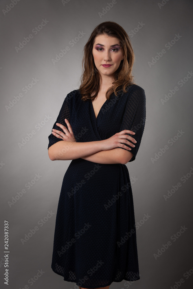 Beauty portrait of a cute young woman over gray background Beauty portrait of a cute young woman over gray background