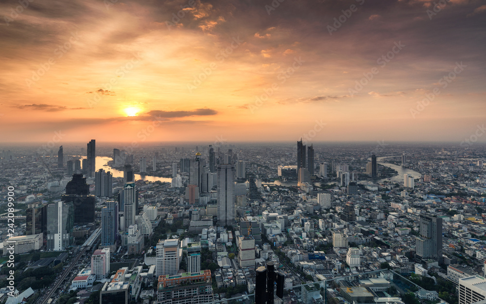 Sunset on Crowded building with Chao Phraya river at Bangkok city, Thailand