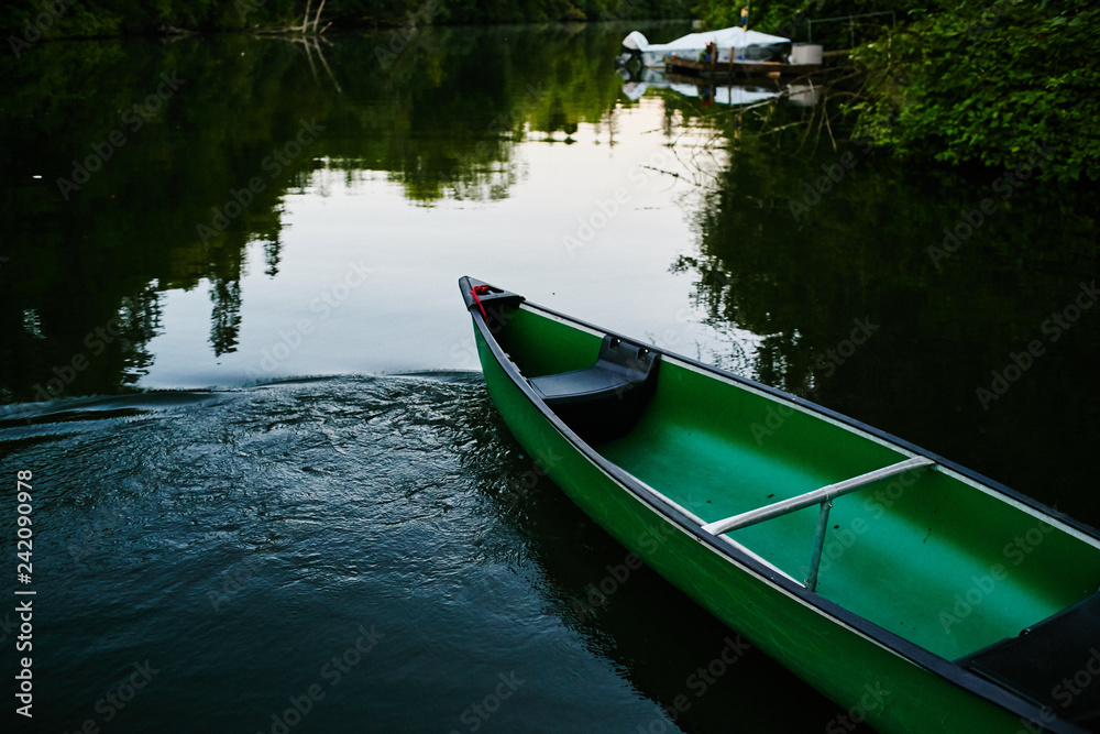 canoe sitting on lake empty
