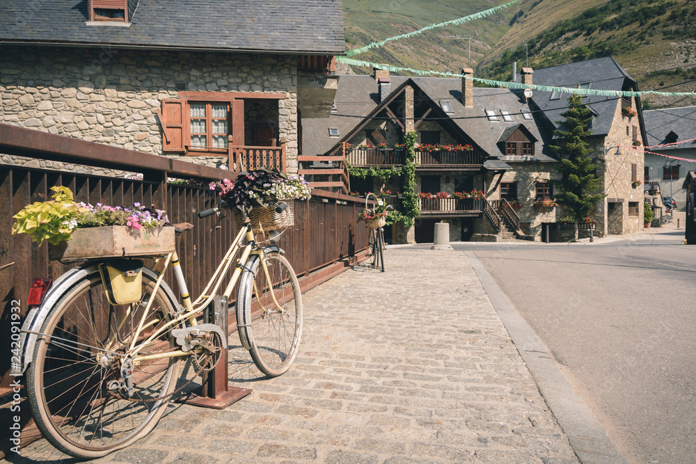 Old bicycles on a bridge in a small village in the Catalan Pyrenees