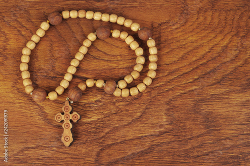 Wooden crucifix on wooden table