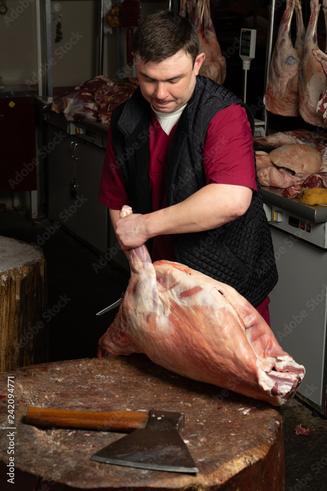 The chopping the meat, professional work of the butcher