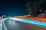 light painting fast cars drive on mountains road, Nago, Italy