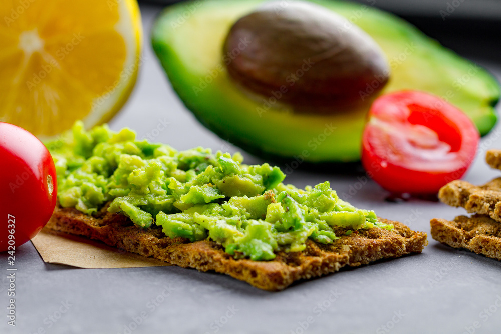 Avocado sandwich with avocado cream and rye crisp bread for snack. Fiber, fitness and diet food. Avocado sandwich with avocado cream and rye crisp bread for snack. Fiber, fitness and diet food.