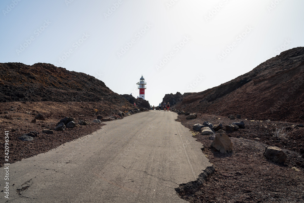 Road to the lighthouse on the rocky shore of the Atlantic Ocean. Cape Teno (Punta de Teno). Tenerife. Canary Islands. Spain.