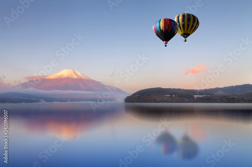 Photography Hot air balloon flying  over the lake with Mount Fuji in background