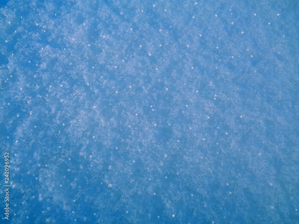 bright blue snow texture.glowing ice particles.