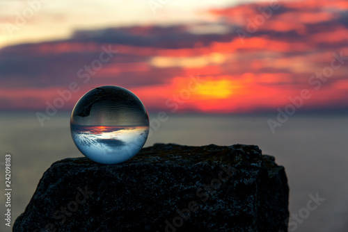  Upside down sunset landscape at Cape Kaliakra, Bulgaria, Eastern Europe - reflection in a lensball - selective focus, space for text