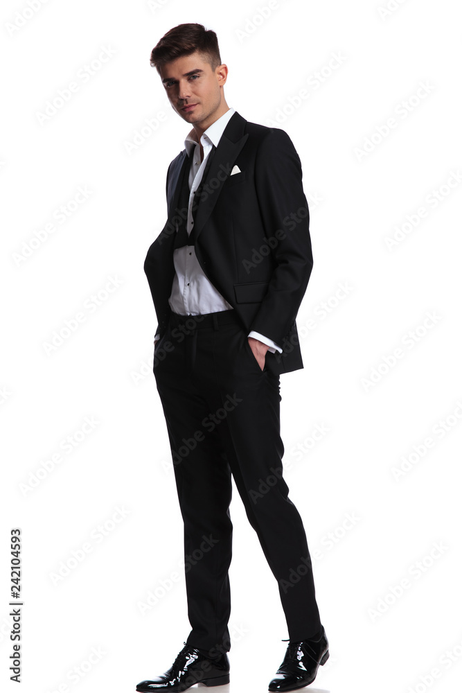relaxed happy businessman wearing a black tuxedo walks relaxed happy businessman wearing a black tuxedo walks