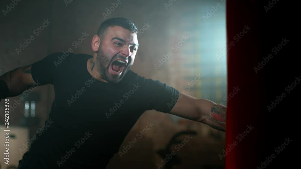 Super slow motion of young man training box, filmed on high speed cinema camera, 1000fps Super slow motion of young man training box, filmed on high speed cinema camera, 1000fps