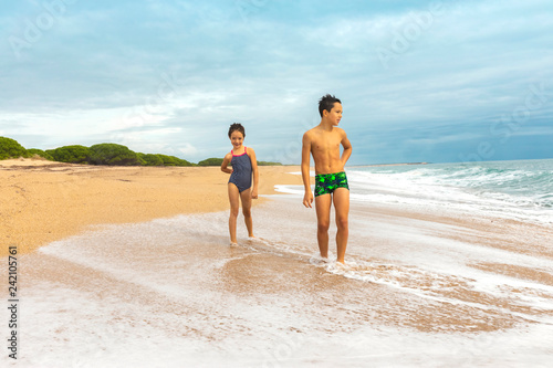 Kids playing on the beach. Active and healthy childhood.